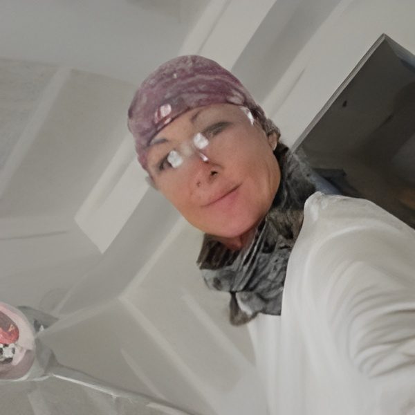 Person wearing bandana and safety glasses